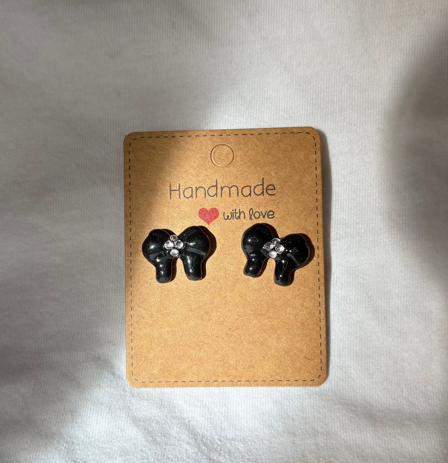 Black bow studs with gems