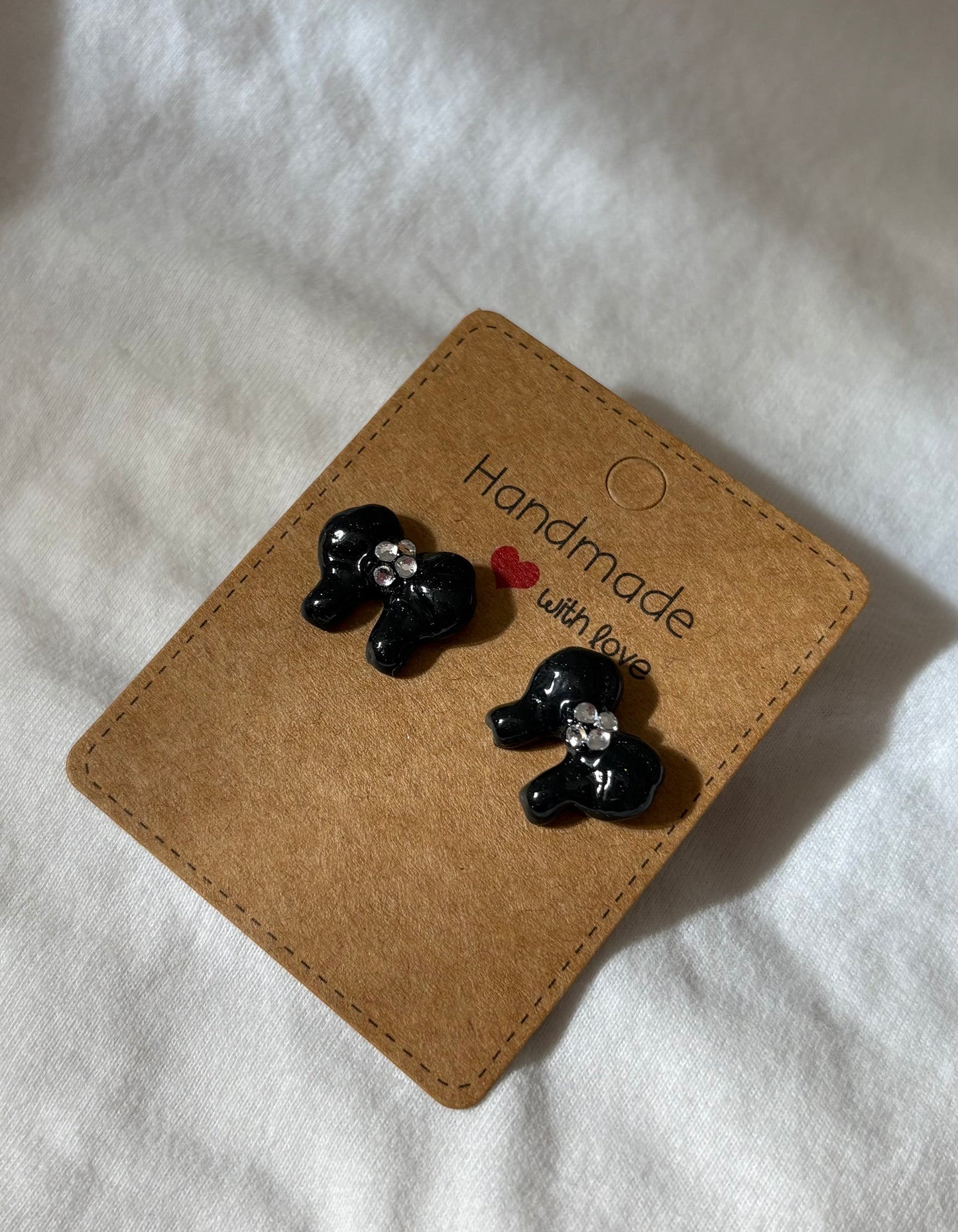 Black bow studs with gems