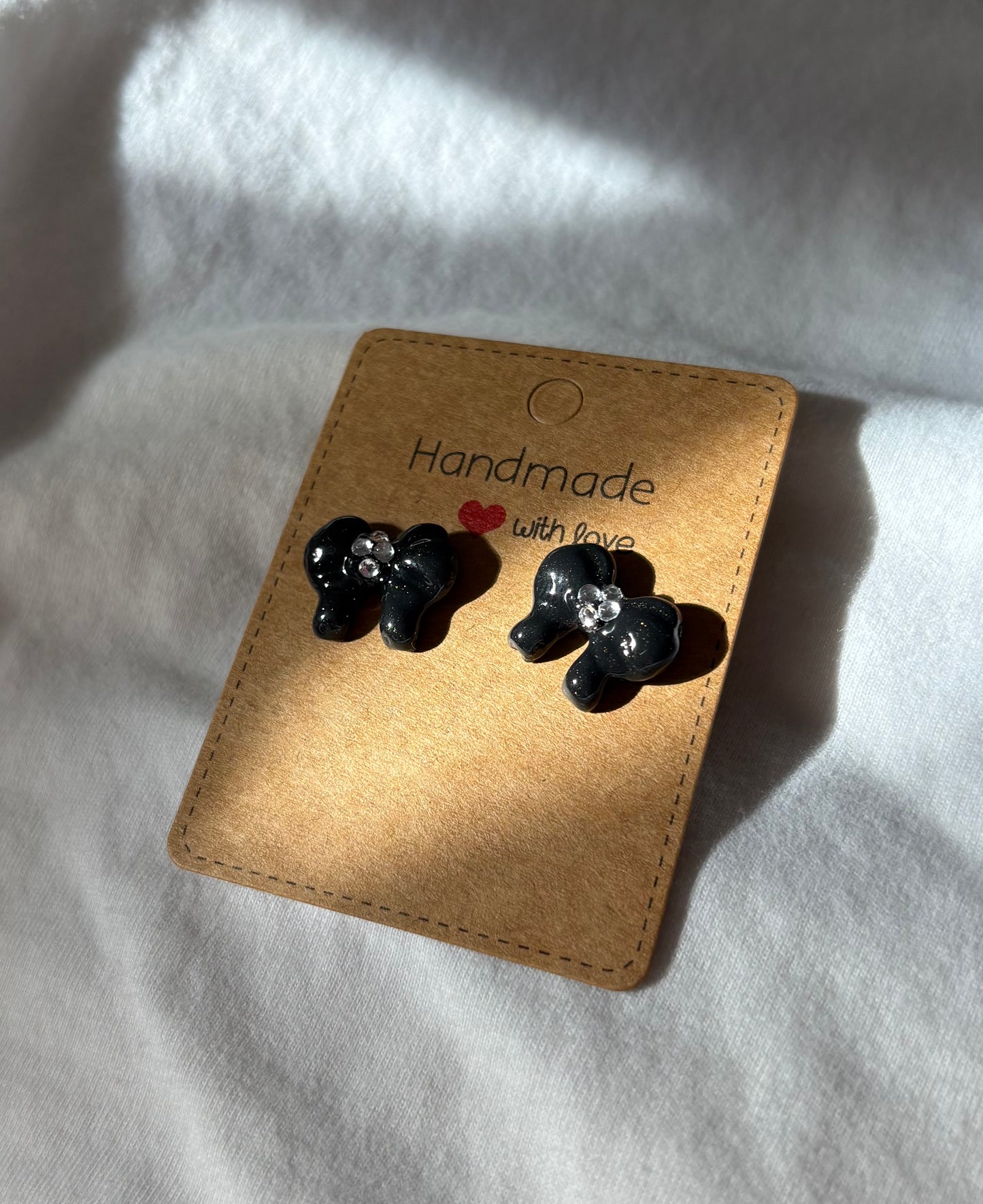 Black bow studs with gems